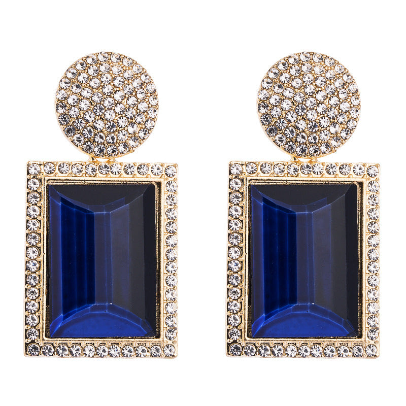 Boucles d'oreilles géométriques tendance en métal et diamants